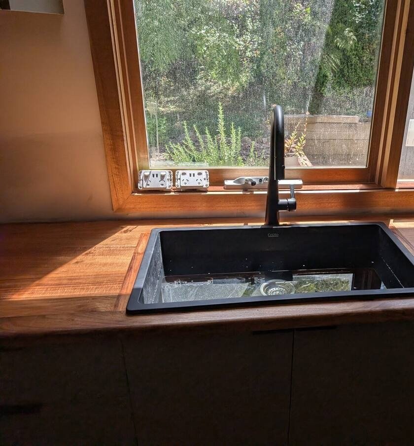 Blackwood kitchen island benchtop showing natural timber grain and figure