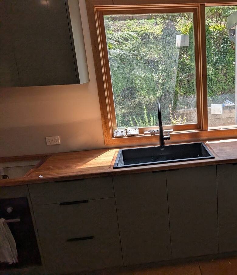 Blackwood kitchen benchtop with sage green cabinetry handcrafted by Ca La Donna in Warburton