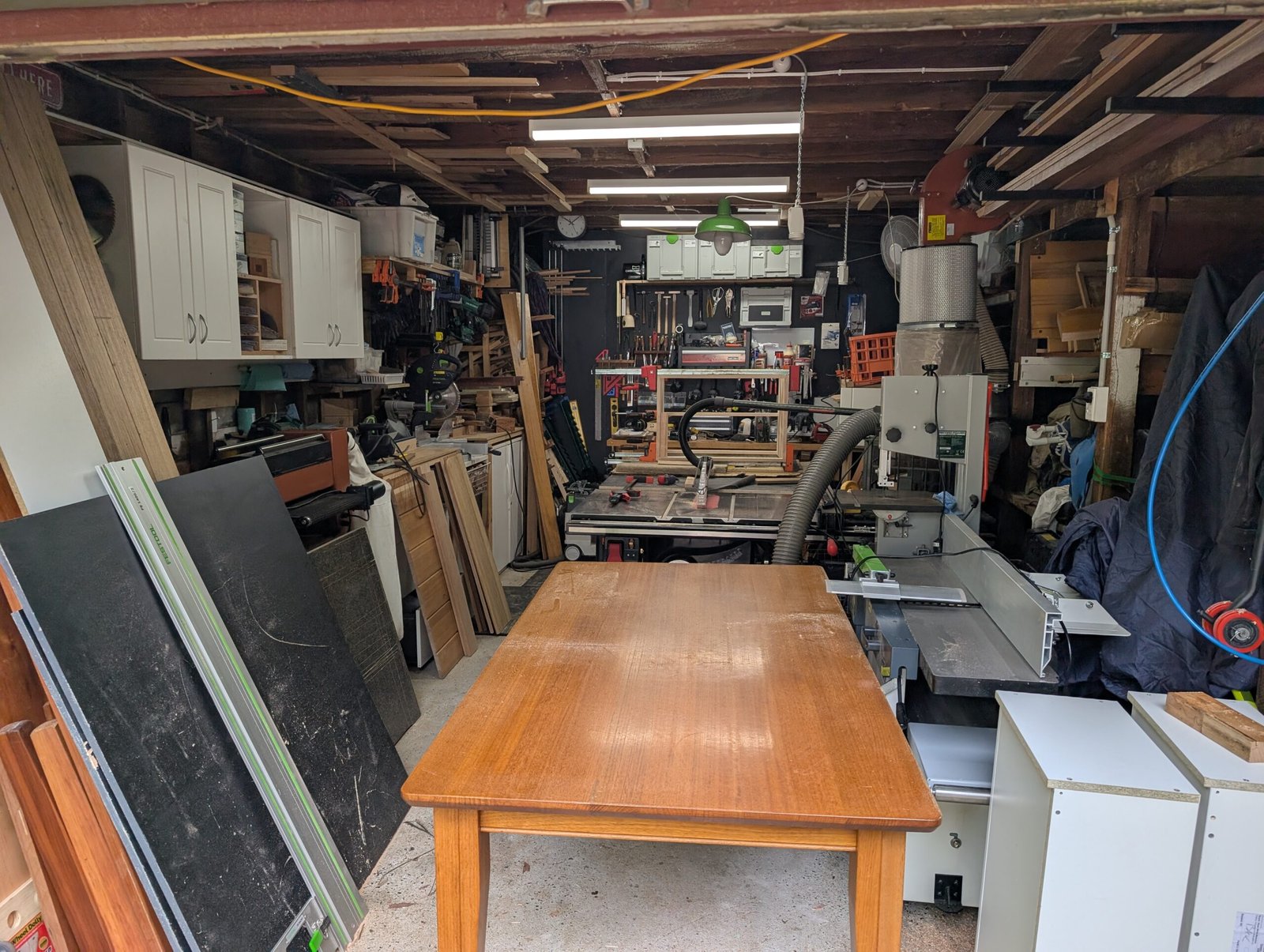 Wide view of Ca La Donna workshop with timber table and machinery