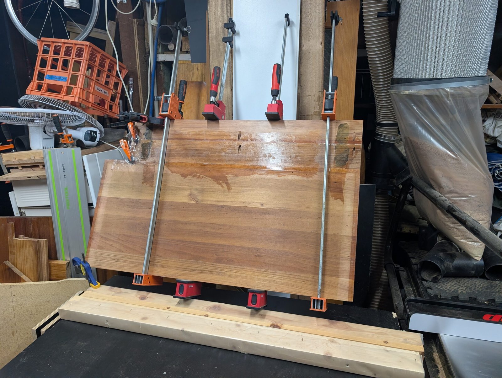 Custom solid timber benchtop being clamped in workshop