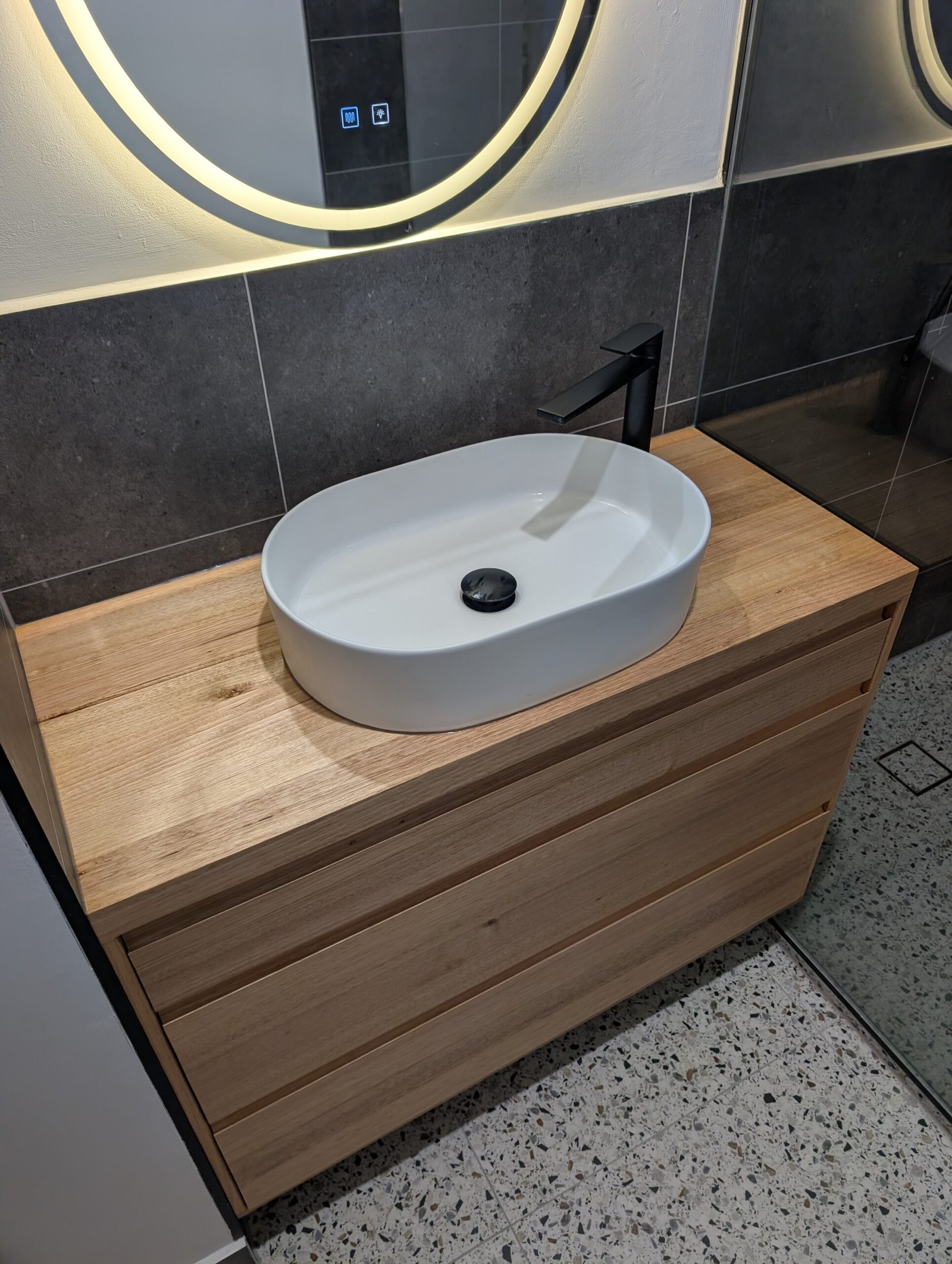 Vessel basin detail on timber vanity