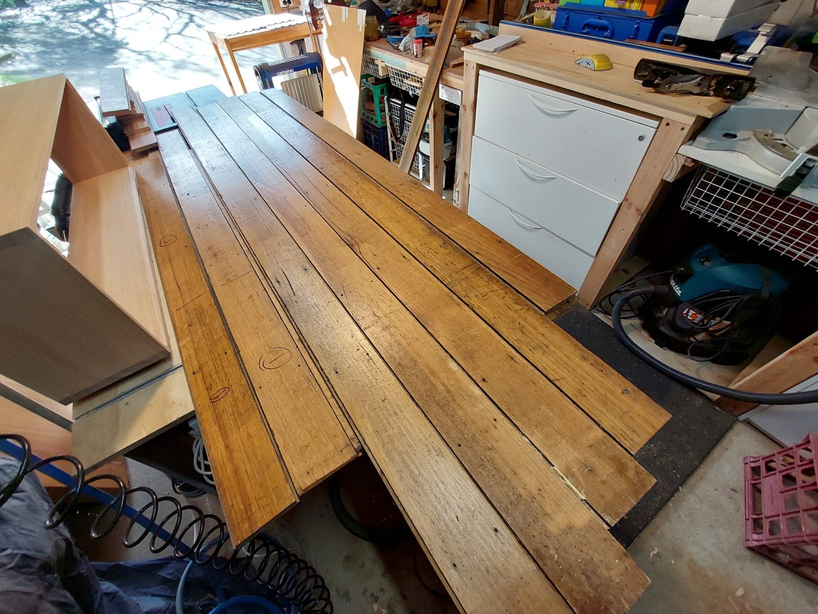 Reclaimed floorboards before being recycled into a Charo