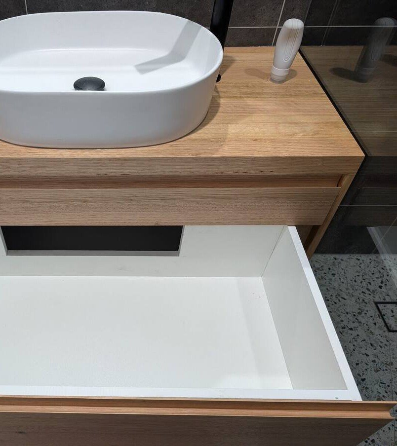 Custom timber drawer dividers inside handmade bathroom vanity drawer
